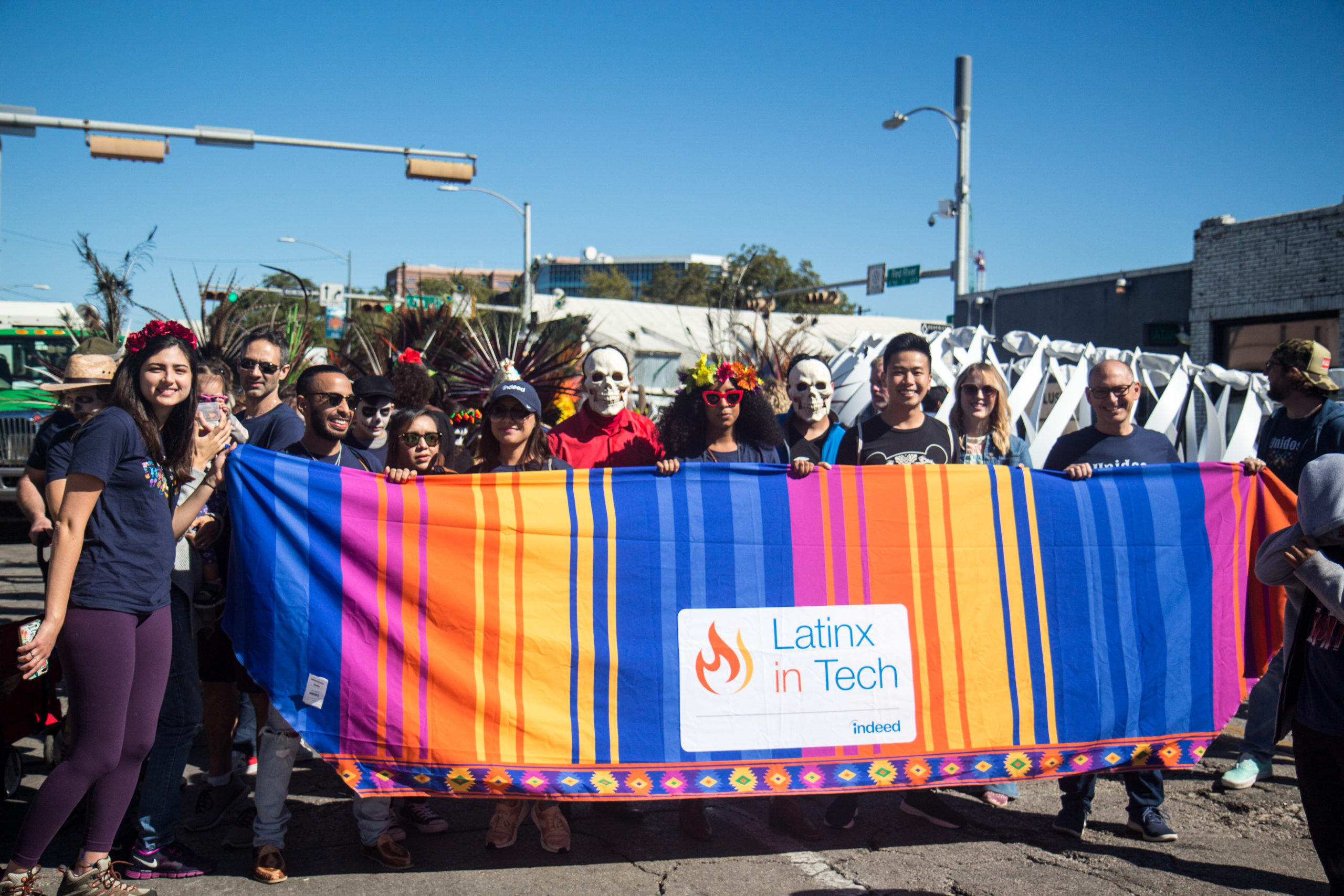 LatinX group with a banner at a parade