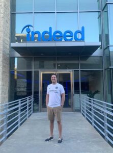 Gregg poses outside an Indeed office in Austin
